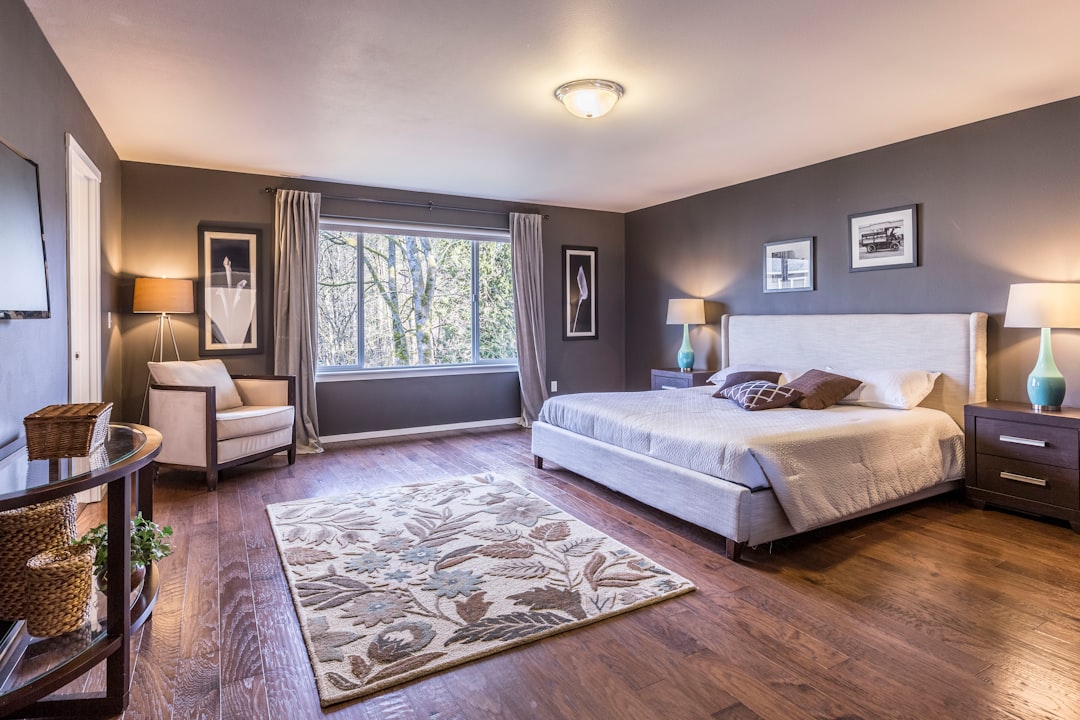 A serene and organized bedroom with neatly arranged furniture, soft lighting, and minimal clutter, creating a calming atmosphere.