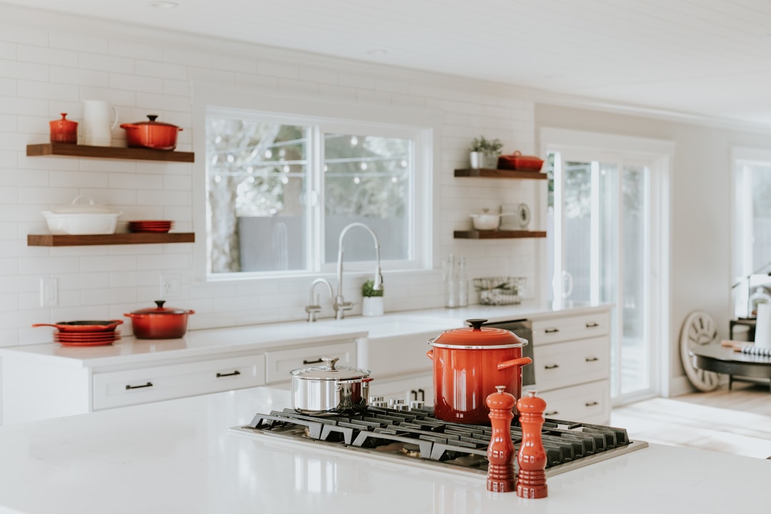A tidy kitchen with organized utensils and a clean countertop, showcasing a pleasant cooking environment.