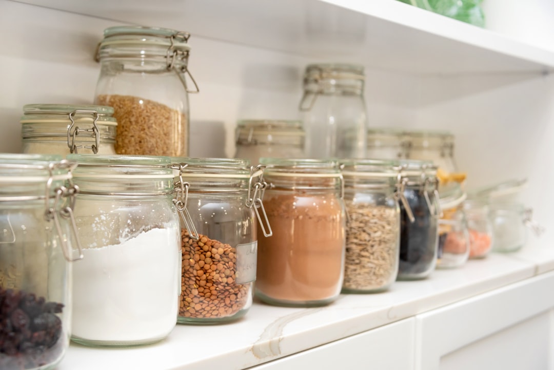 A neatly arranged pantry with labeled containers, fresh ingredients, and a clean aesthetic.