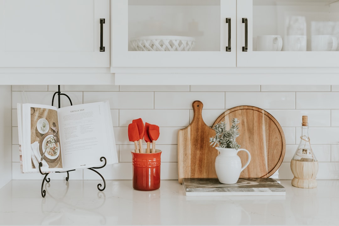 A well-organized kitchen with safety tools like cutting boards, knife guards, and fire extinguishers visible.